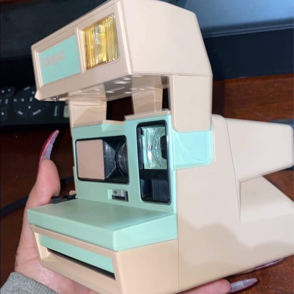 Pink and blue polaroid camera.